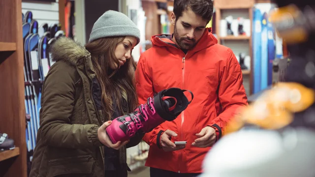 Couple selecting shoe together in a shop