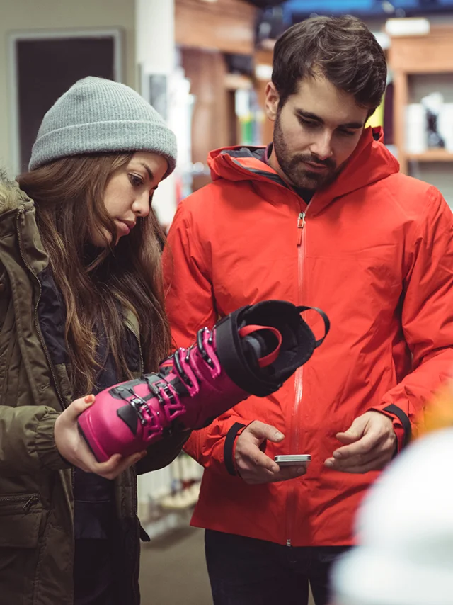 Couple selecting shoe together in a shop