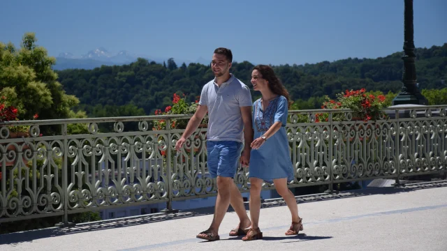 Couple Walking On Boulevard Des Pyrenees