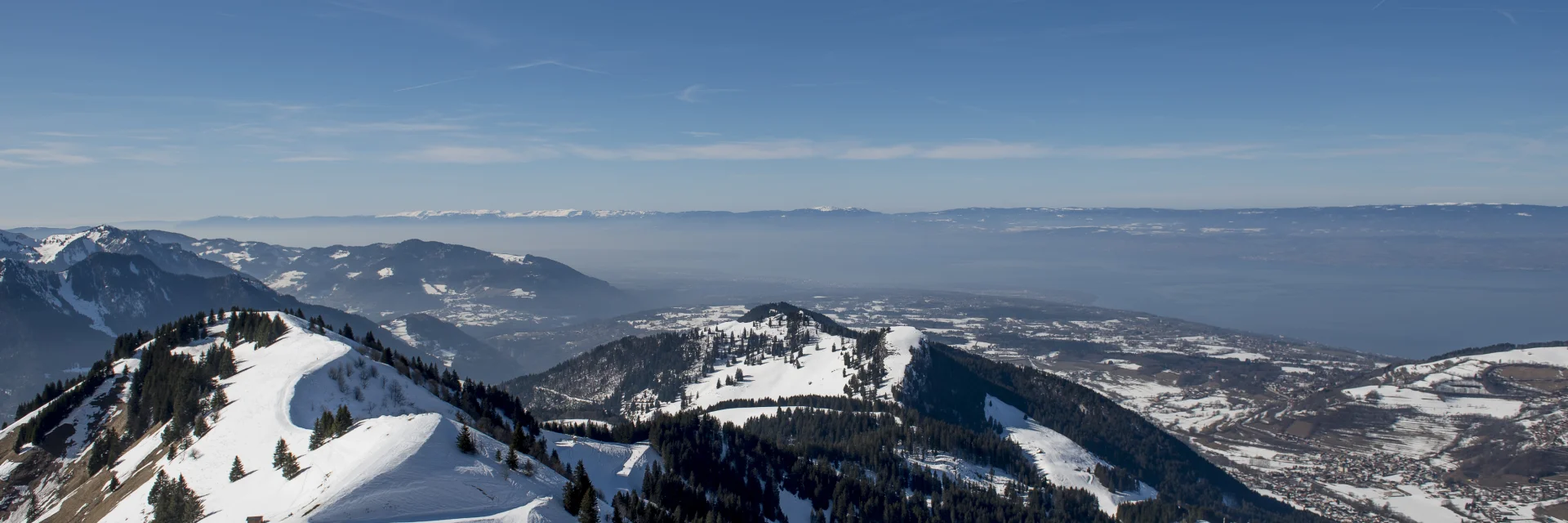 Snow-covered Bernex mountains overlooking Lake Geneva