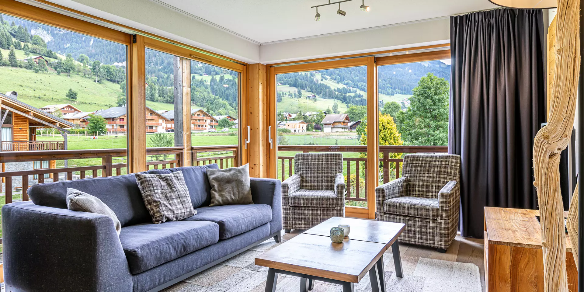 Apartment with large bay windows, sofa and coffee table