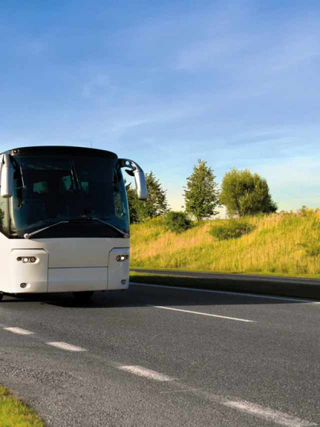 tour bus traveling down a major highway