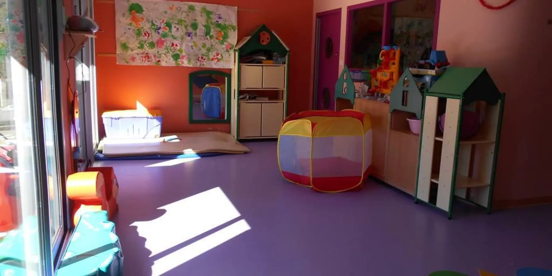 Children's playroom with colorful toys and furniture