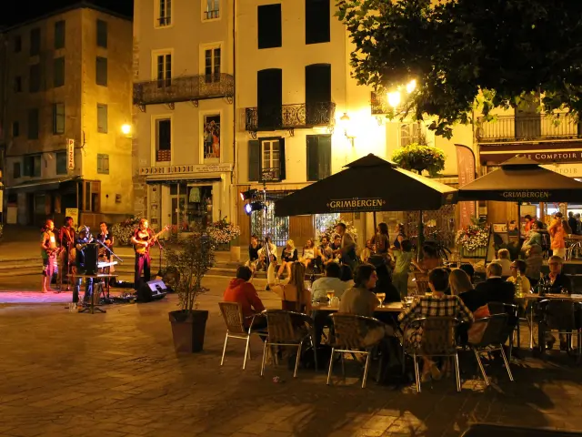 Group of people on a terrace with live music