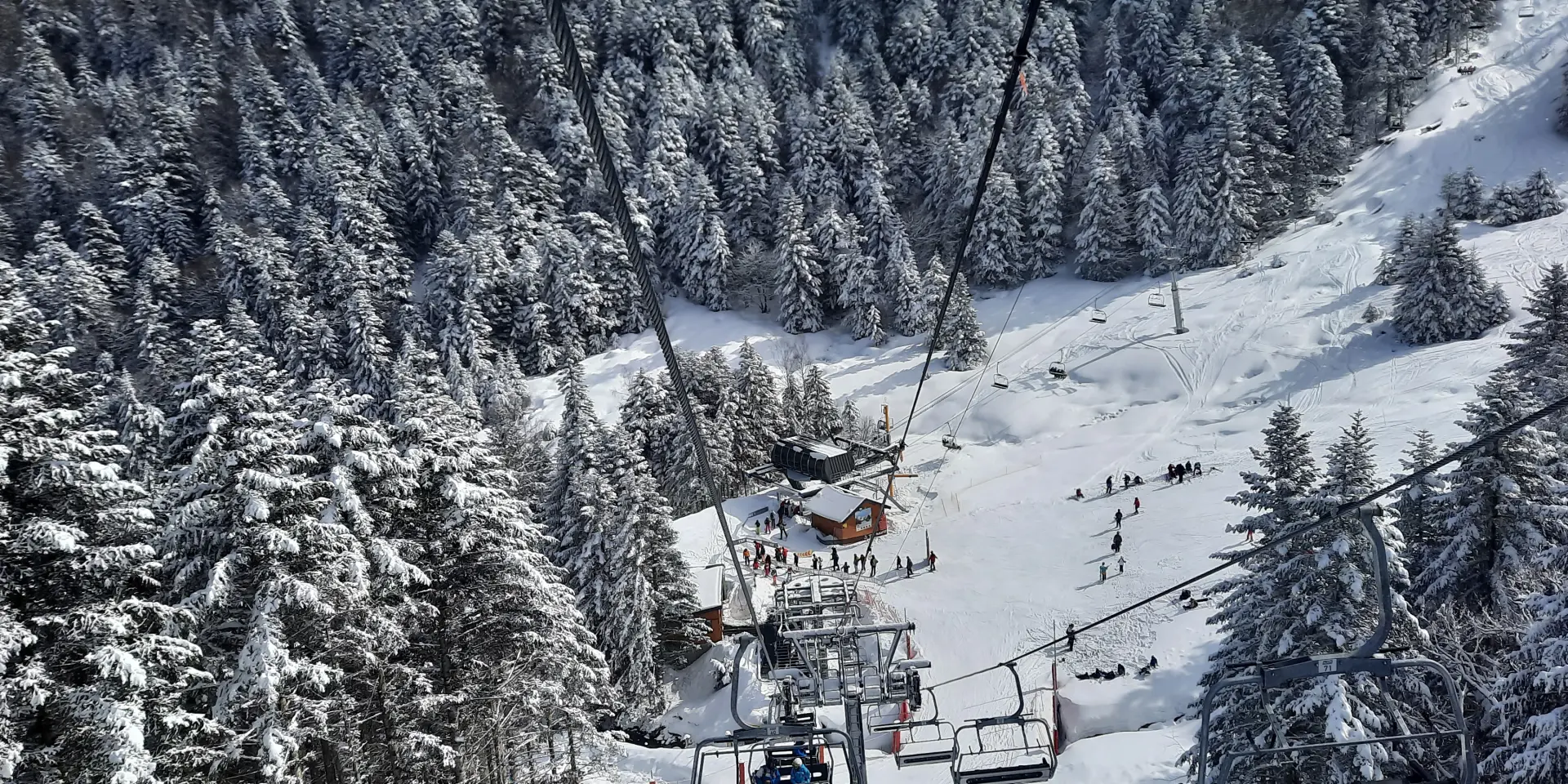 Ski slope with ski lift and skiers