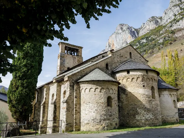 Ancient stone church with a bell tower and thick walls