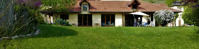 Country house with garden and mountains in the background