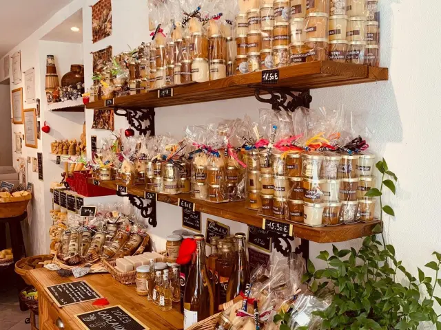 Shelves filled with jars of honey and artisan products