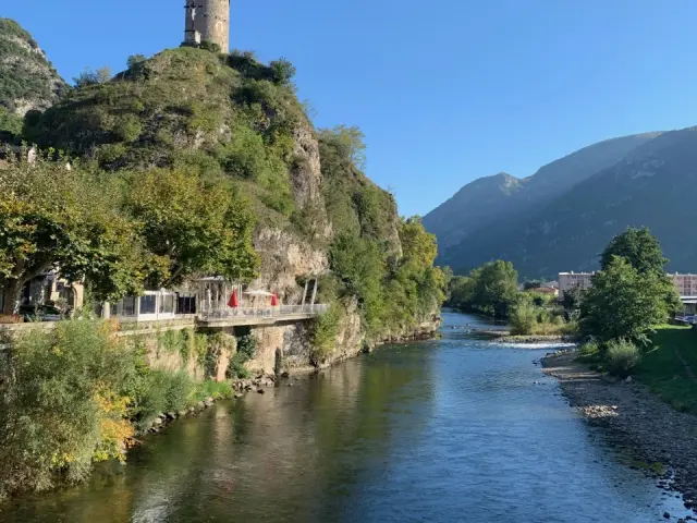 Ancient tower on a hill above a river