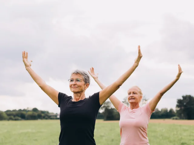Elderly Women Doing Tai Chi Outdoors - Carolin Voelker