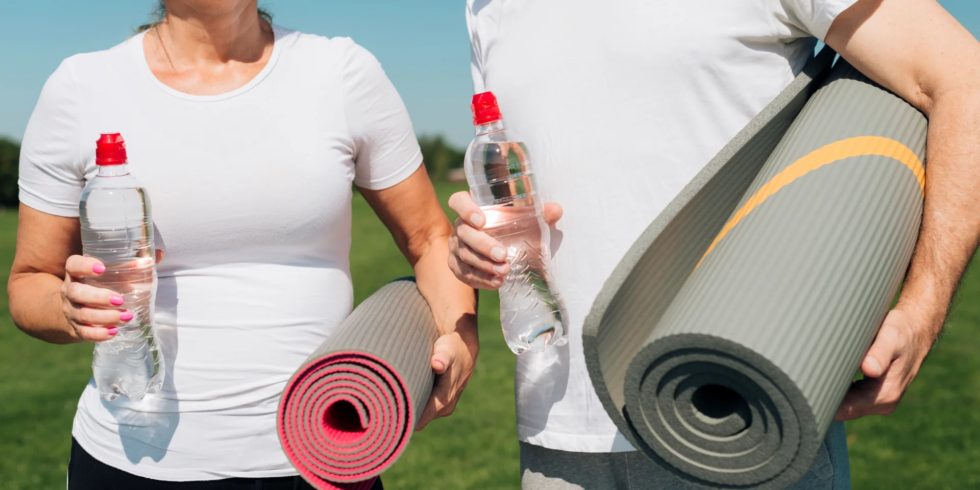 Close Up People Holding Yoga Mats