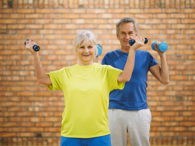 Elderly Couple Working Out Gym