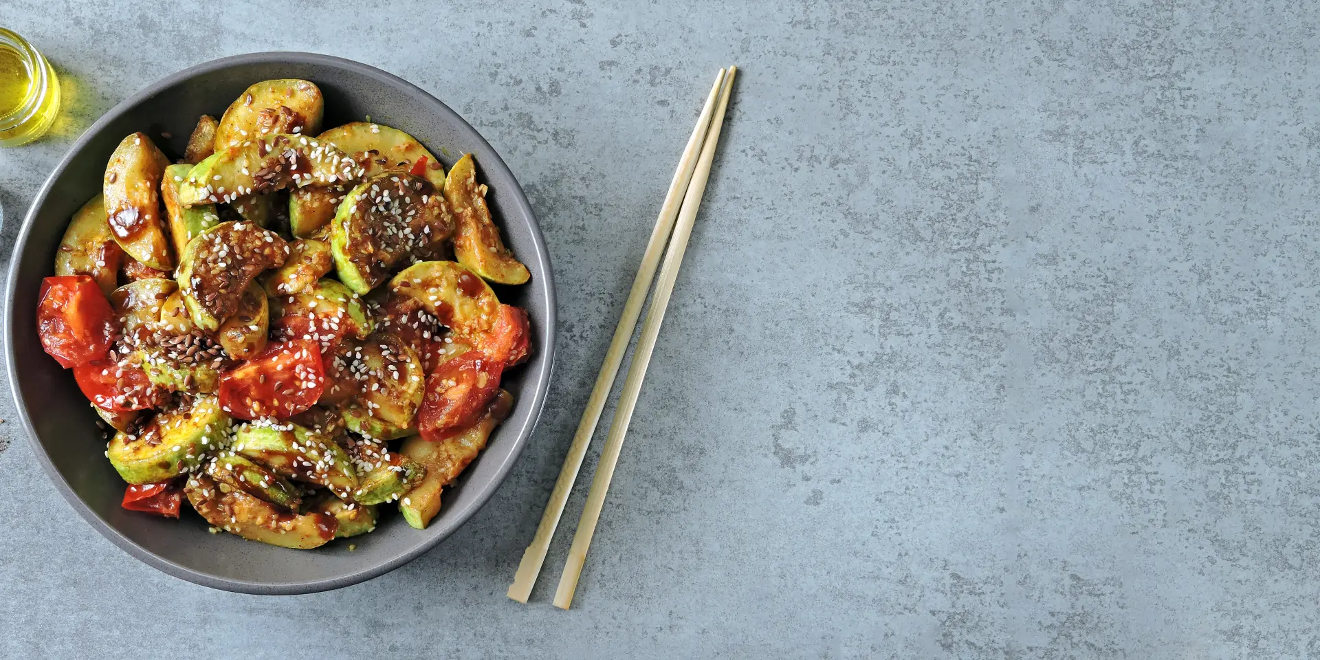 Stewed zucchini with soy sauce and sesame. Squash in Chinese style.