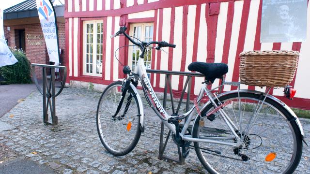 photo of a bicycle parked in front of the Louviers tourist office