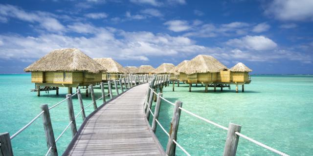 Pier and overwater bungalows of the hotel Le Taha'a