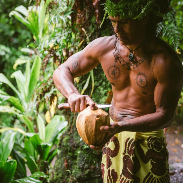 Tourist Guide Preparing Coconut Water