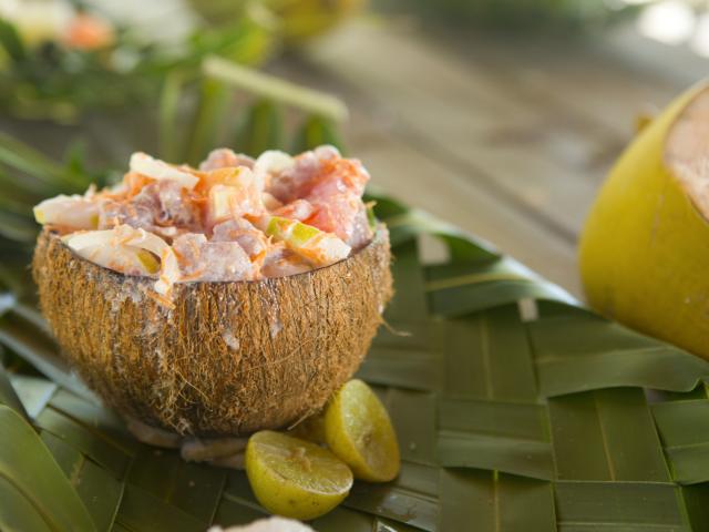 Raw fish with coconut milk in a coconut bowl