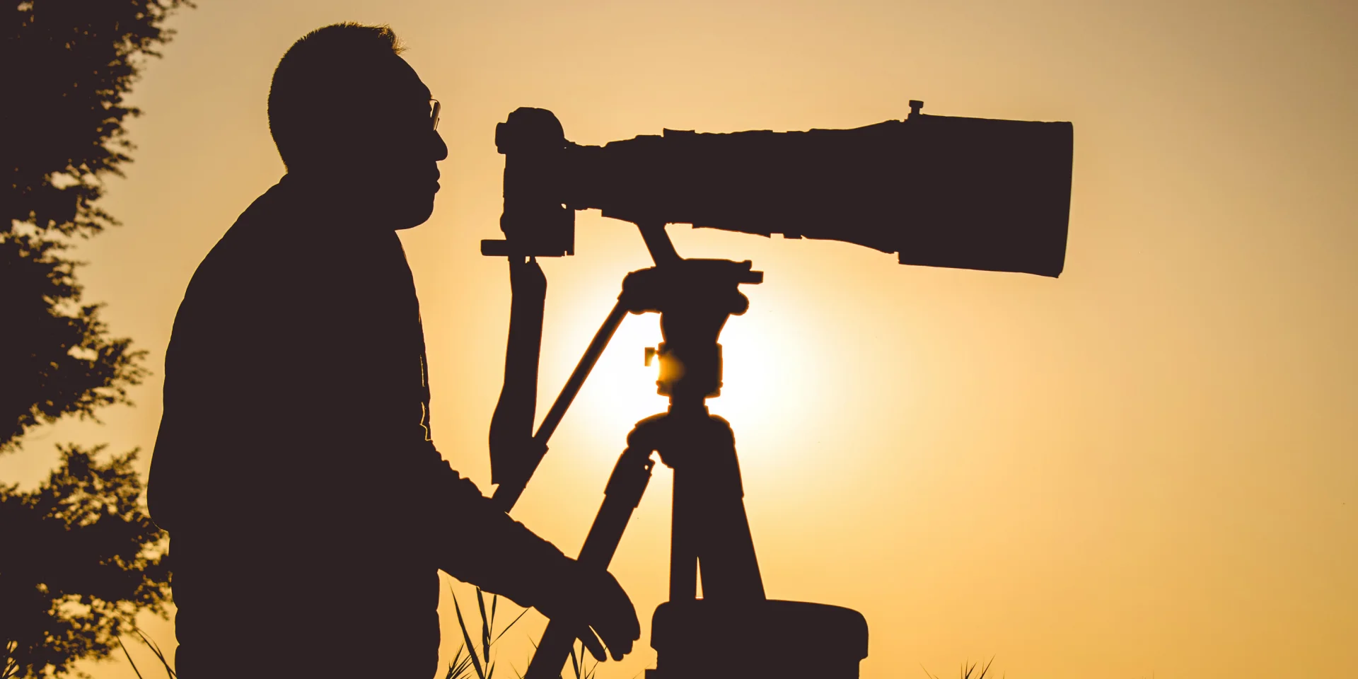 photographe contrejour téléobjectif trepied