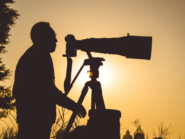 photographe contrejour téléobjectif trepied