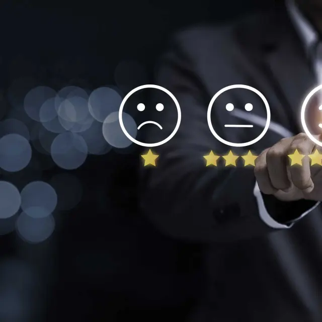 Businessman touching smile face icon for customer online evaluation result for five star. Customer satisfaction for product and service concept.