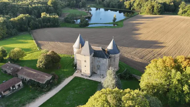 Chateau De Brie And Its Pond In Limousin