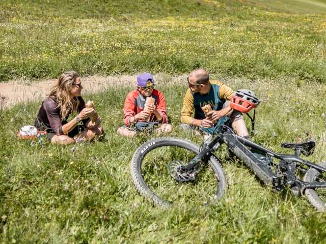 bike park; break; sandwich; bicycle; family