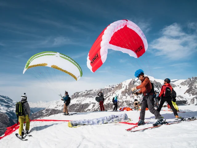 paragliding; group; winter; beautiful view; ski