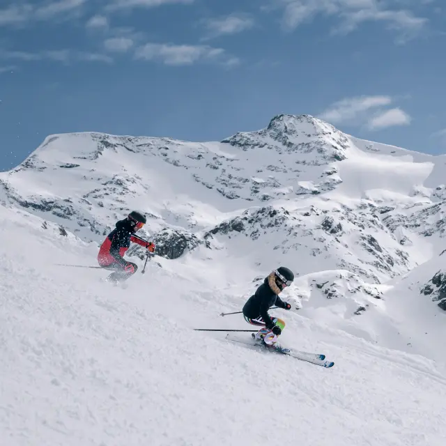 Skiers and snowboarders on the slopes of Val d'Isère