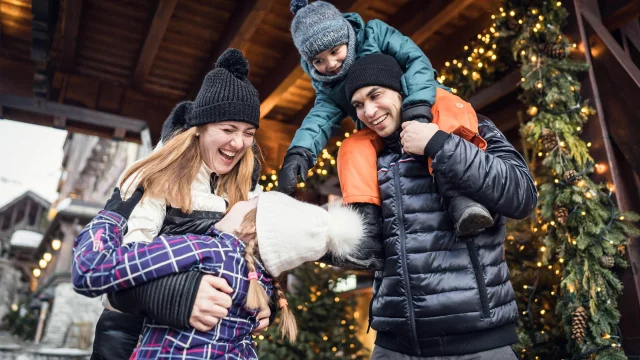 Family and children having fun in the village at Val d'Isère