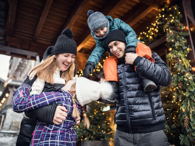 Family and children having fun in the village at Val d'Isère