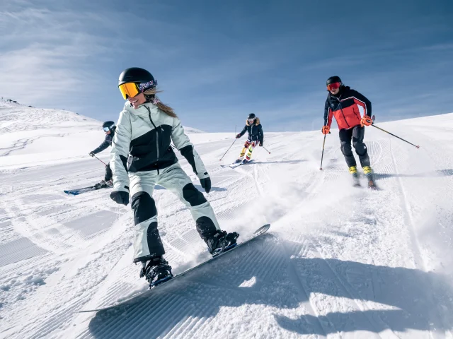 Skiers and snowboarders on the slopes of Val d'Isère