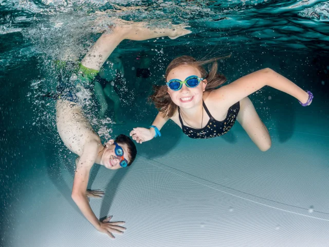 Children in the water at the Centre Aquasportif in Val d'Isère