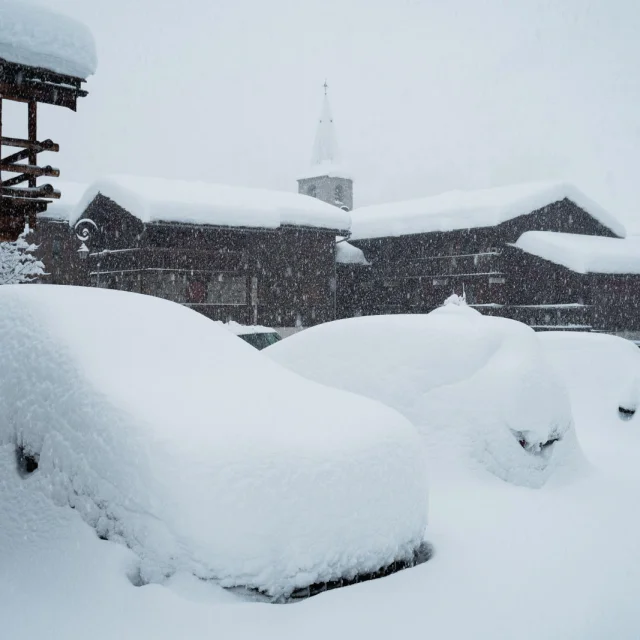 Val d'Isère village cars under the snow