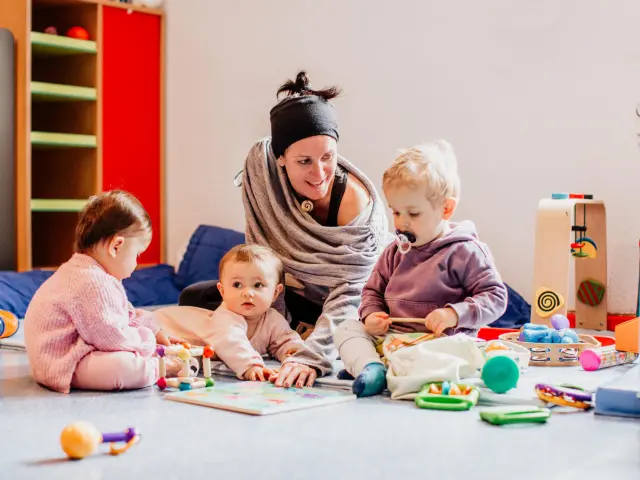 Babies and young children with their carer playing at Chalet des Aiglons in Val d'Isère.