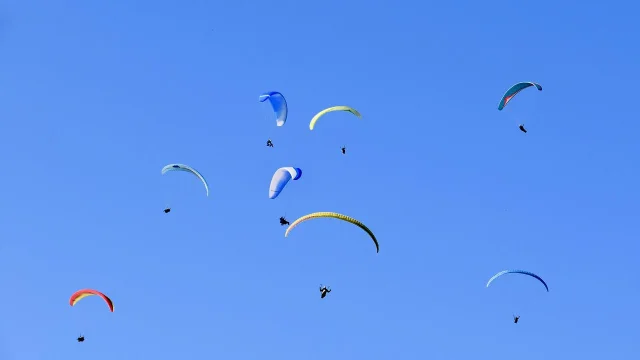 Group of paragliders in the sky