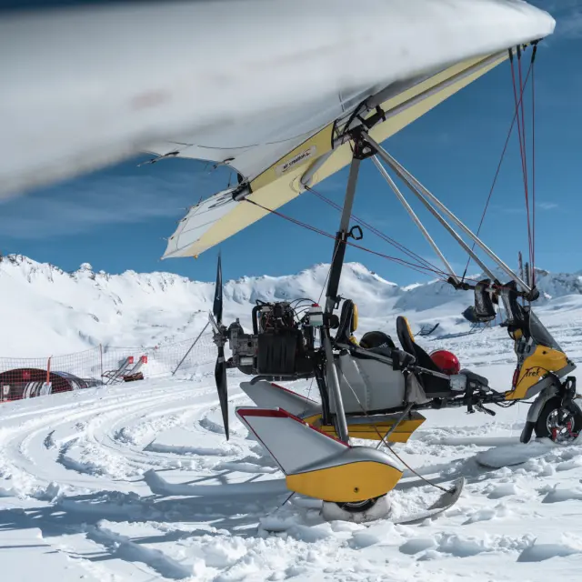ULM high above snow-capped mountains