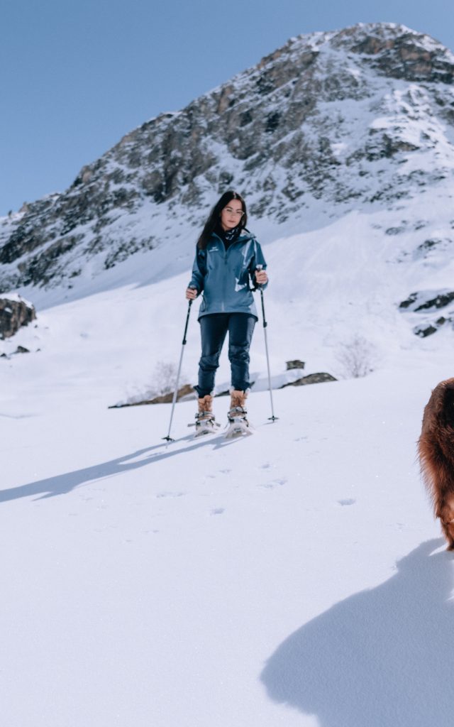 RoseLabeille with her dog on a snowshoe outing