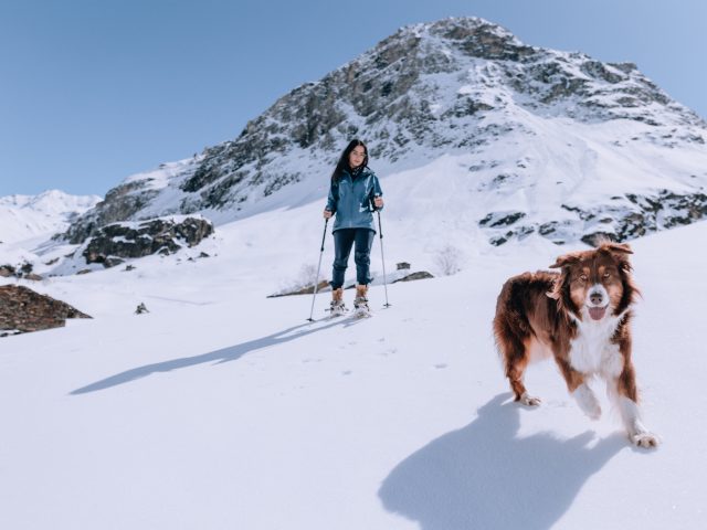 RoseLabeille with her dog on a snowshoe outing