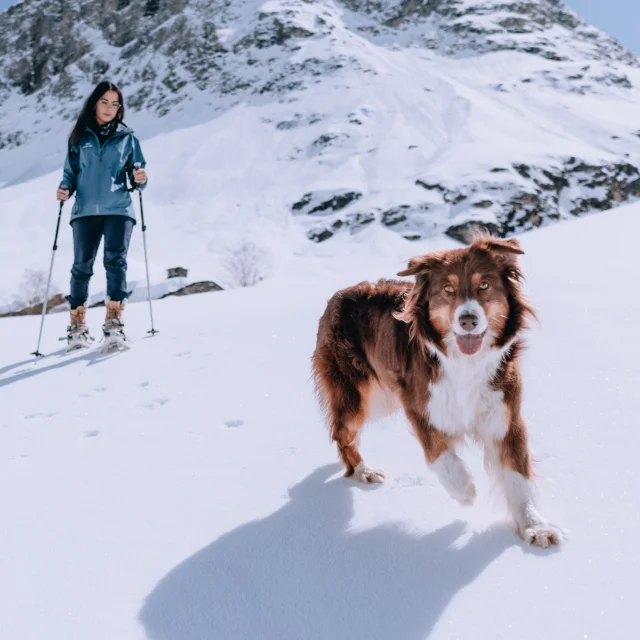 RoseLabeille with her dog on a snowshoe outing