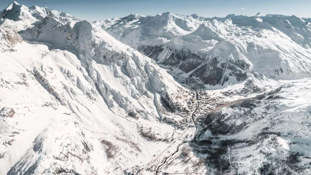 Winter drone view of Val d'Isère village and its snow-capped mountains