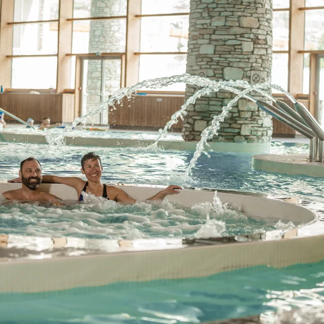 Couple swimming at the Centre Aquasportif in Val d'Isère