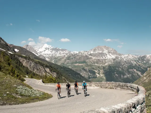 Group of friends on the Col de l'Iseran by bike in summer