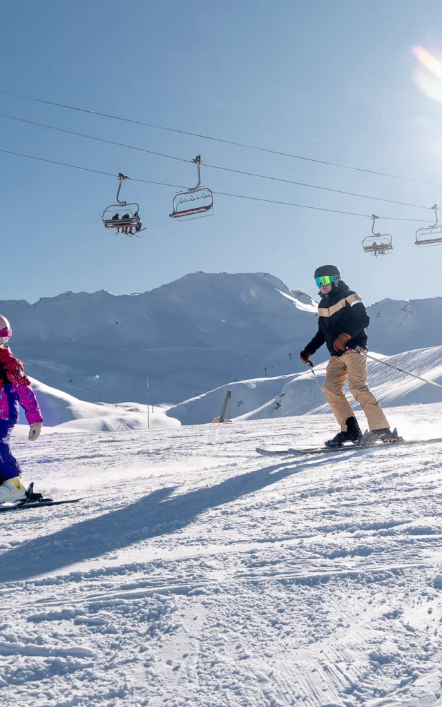 Family skiing with parents and children in Val d'Isère