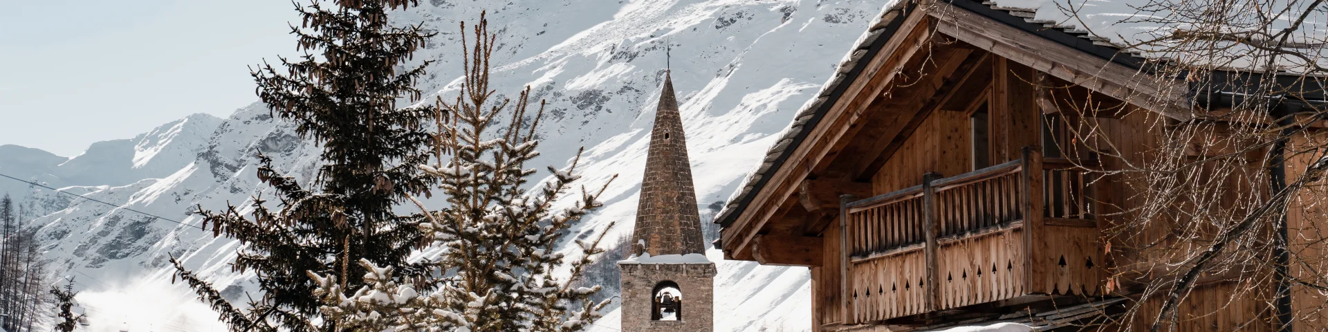 Val d'Isère village in winter with church and bell tower