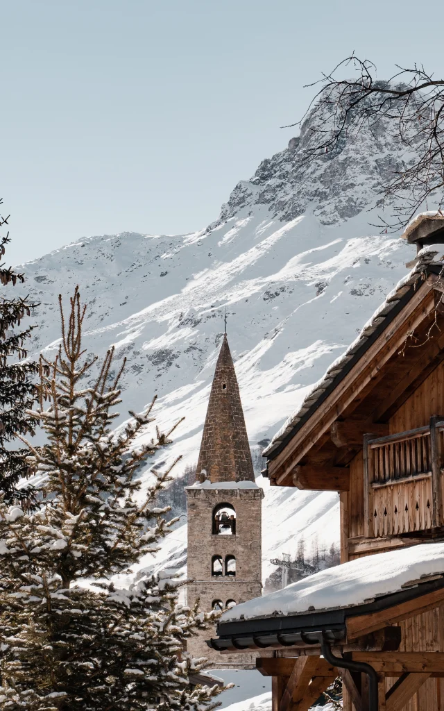 Val d'Isère village in winter with church and bell tower