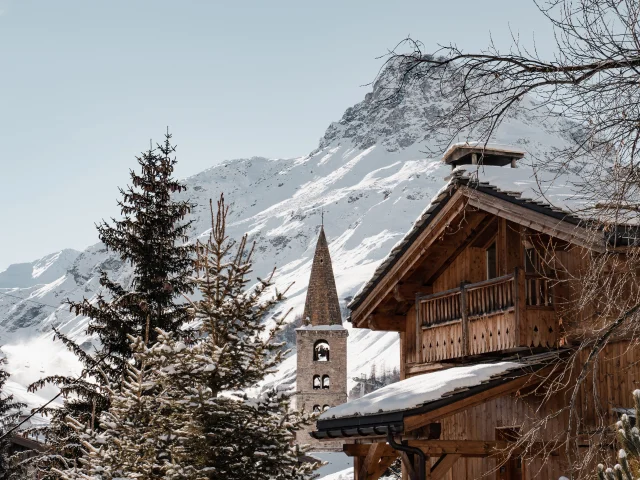 Val d'Isère village in winter with church and bell tower