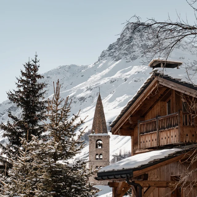 Val d'Isère village in winter with church and bell tower