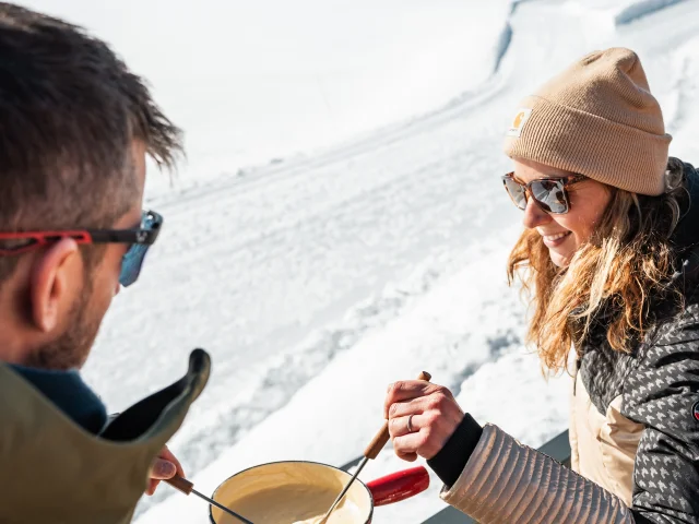 Fondue at the restaurant La Plage de L'Ouillette in winter in Val d'Isère