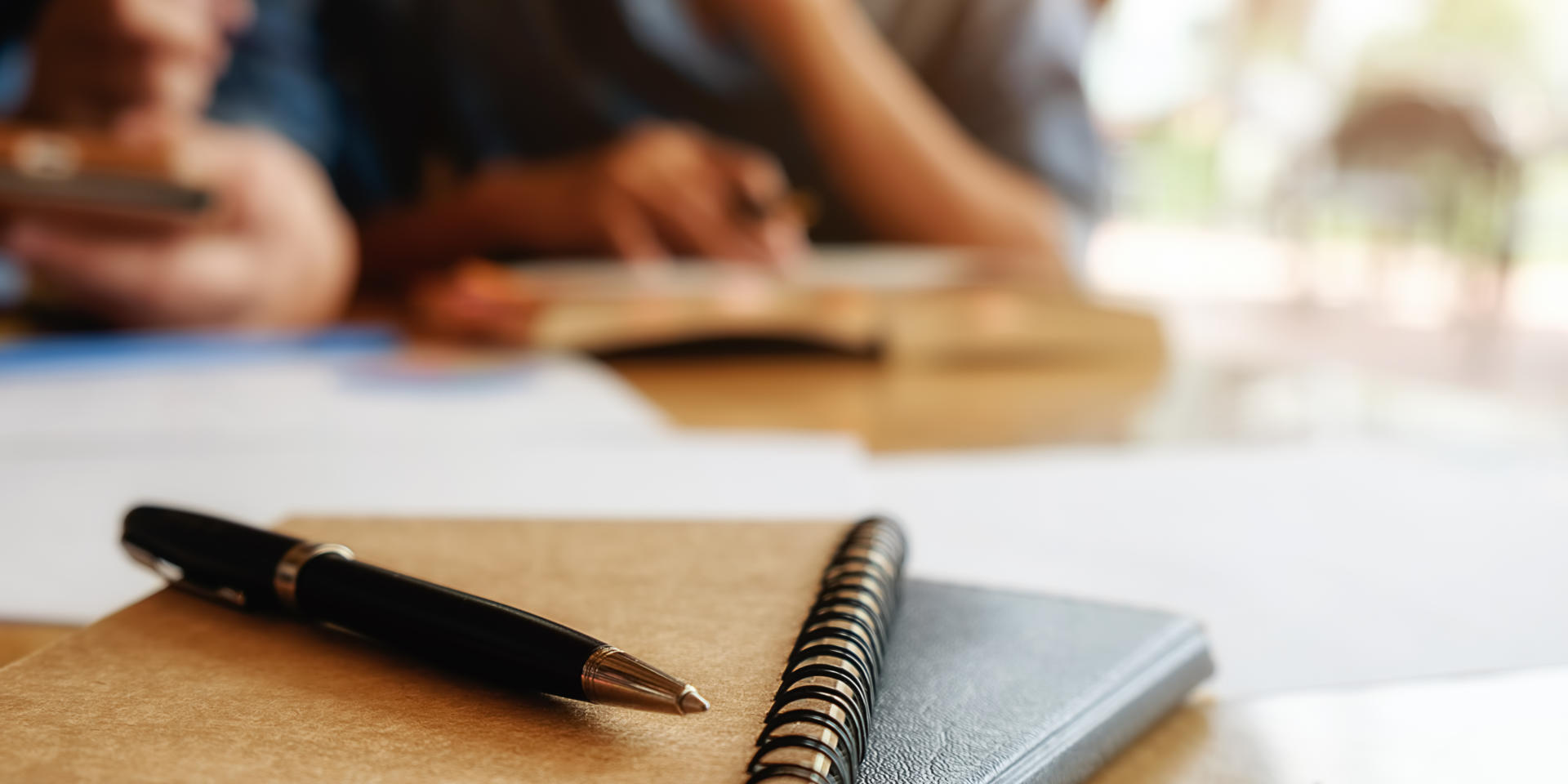 Education concept. Student studying and brainstorming campus concept. Close up of students discussing their subject on books or textbooks. Selective focus.
