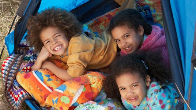 Children Having Fun Inside Tent On Camping Holiday